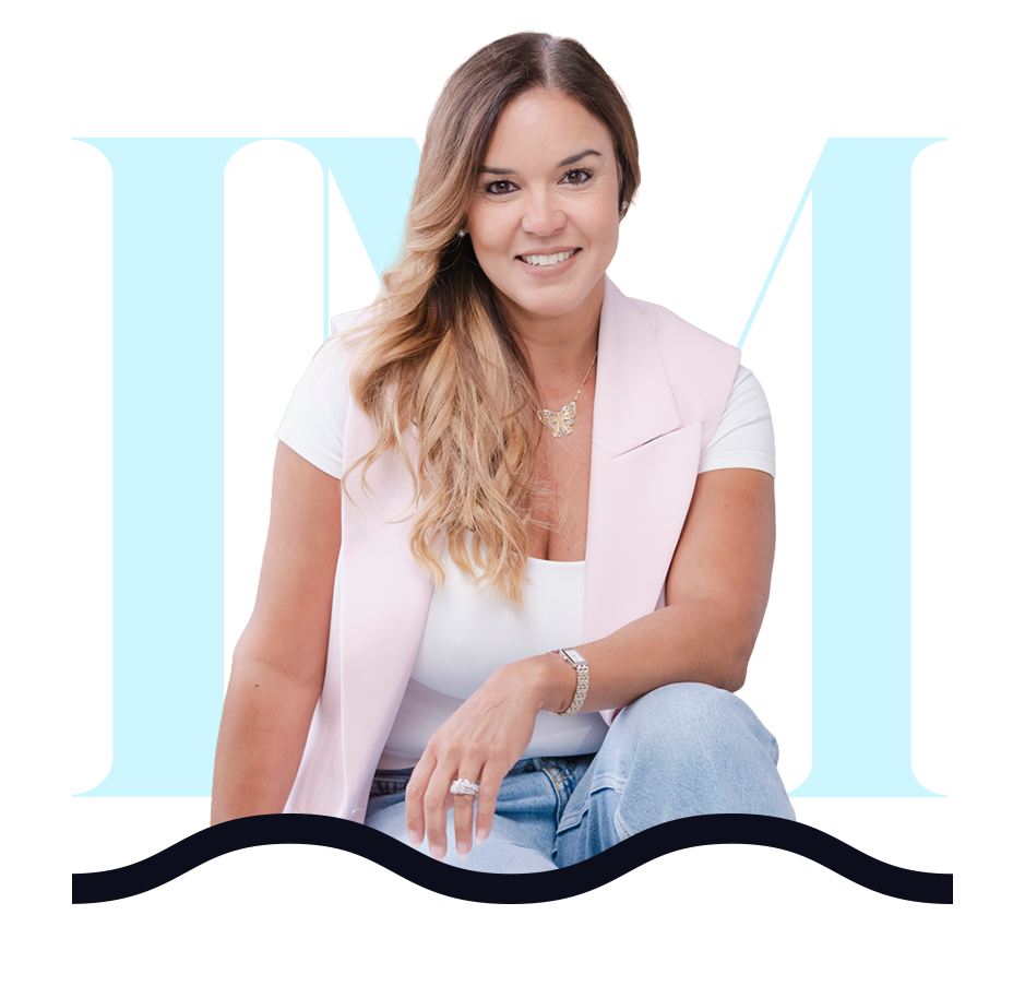 Smiling woman in professional attire representing LM Behavioral Health.
