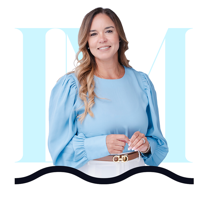 Smiling female mental health professional in blue blouse at LM Behavioral Health.